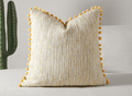 Coussin jaune et beige en tweed avec ponpons 45x45 cm POPINE
