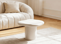 Table basse ronde en béton brossé blanc plateau asymétrique ZELINE
